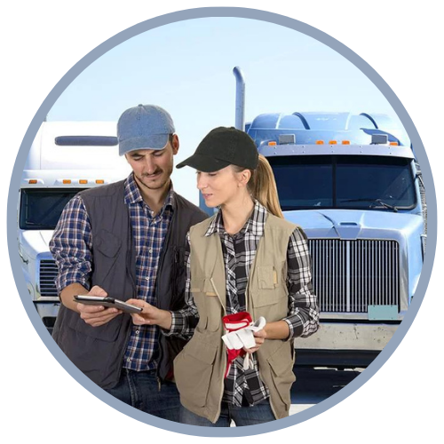 Man and woman reviewing iPad in front of 18 wheeler fleet