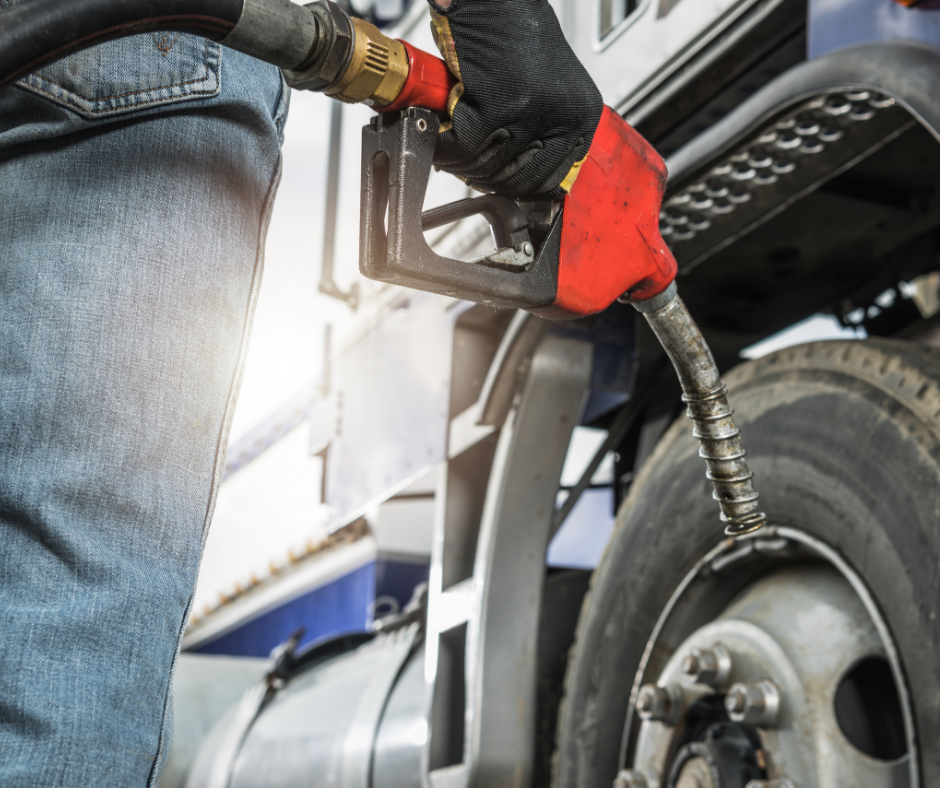Semi-truck fueling at a truck stop, representing cost-plus fuel pricing and fuel savings for owner-operators and fleets.