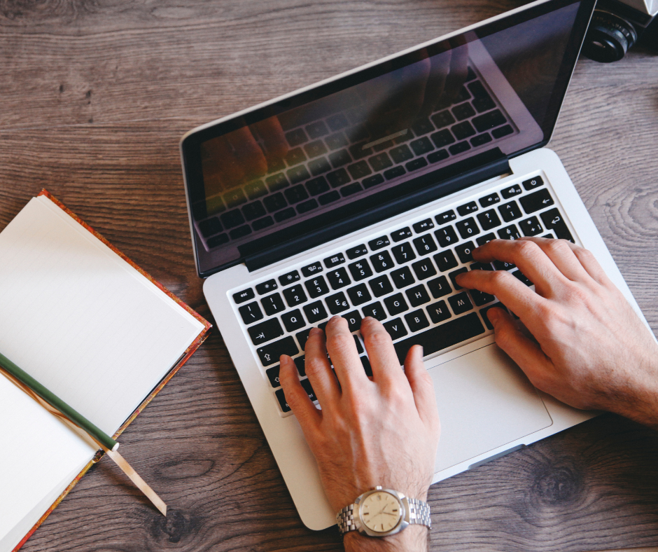 Person typing on laptop