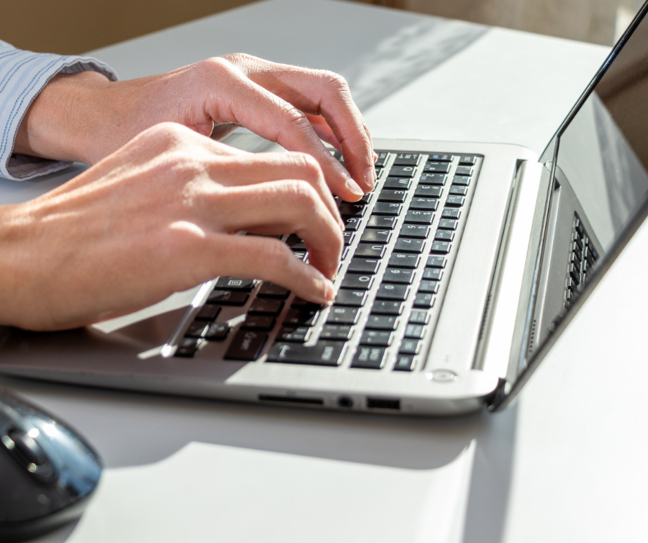 Typing on laptop